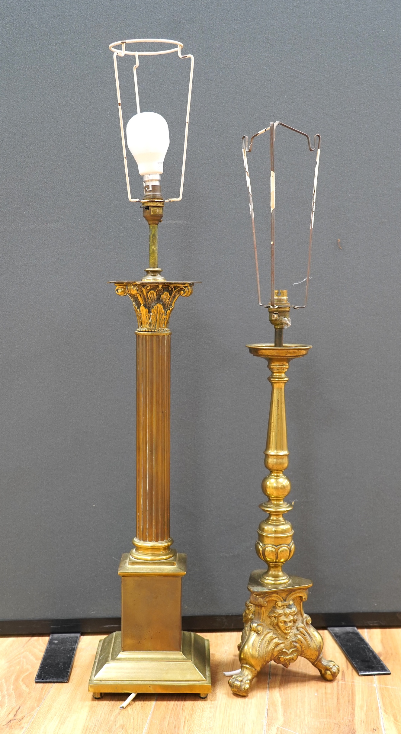 A large brass Corinthian column table lamp and another, largest 60cm excluding light fittings